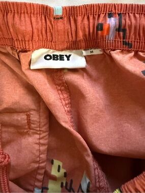 Obey Men's Coral-Peach Swim Trunks with Multicolor Print